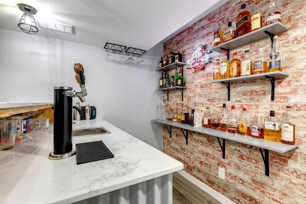 A gleaming quartz countertop in a bespoke basement wet bar during a Calgary home renovation