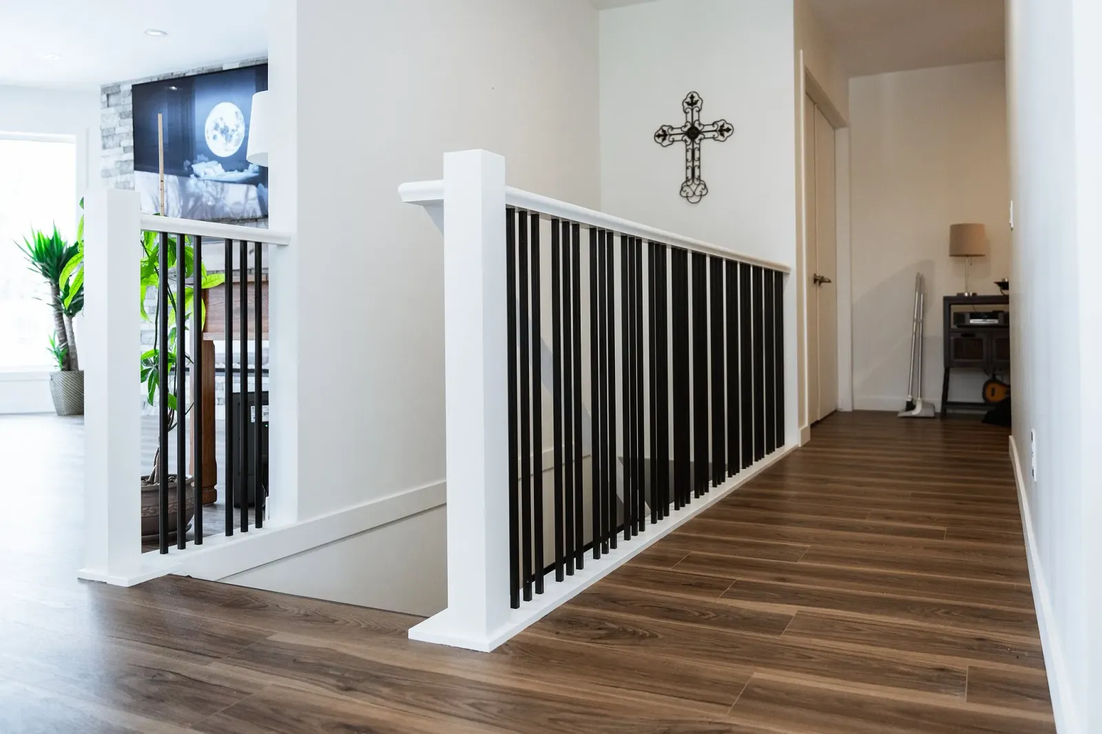 Custom iron stair railings adding modern structure to a Calgary home renovation