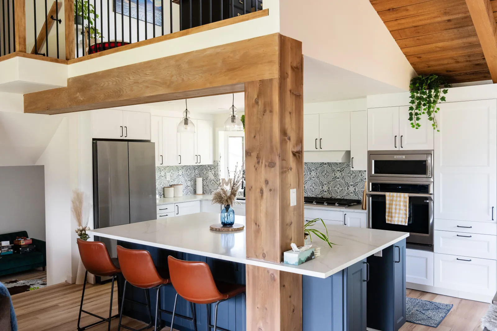 Structural cedar beam enhancing an open-concept kitchen layout in a Calgary renovation