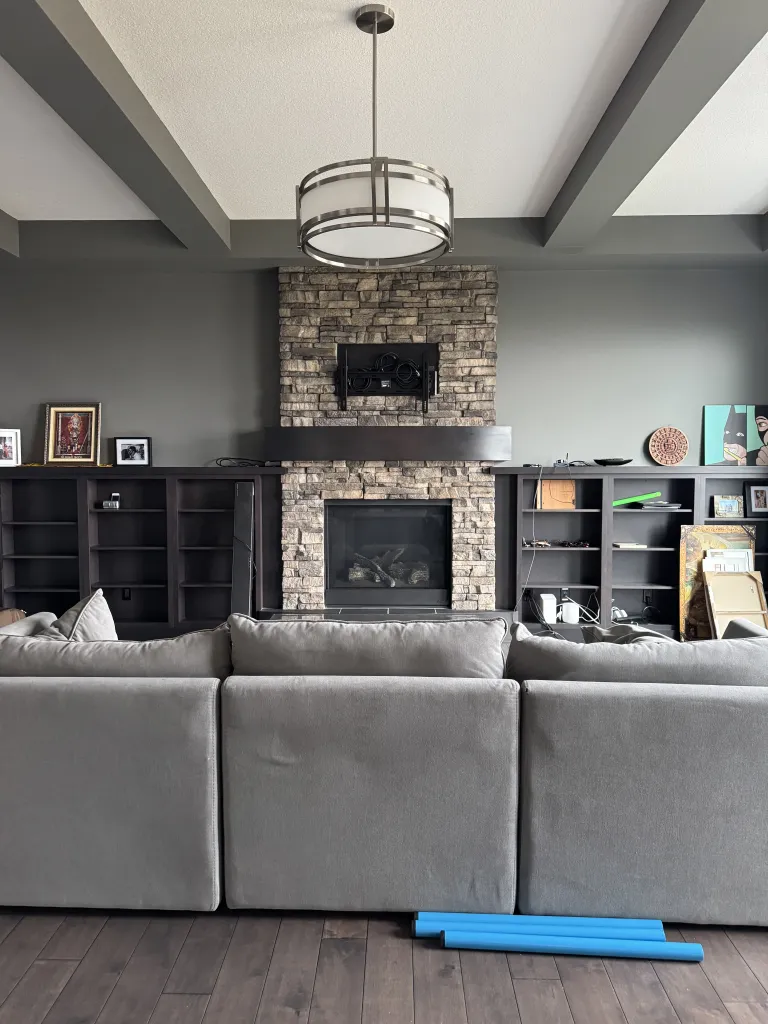 Living room before custom millwork, fireplace and feature renovations in Artesia De Winton