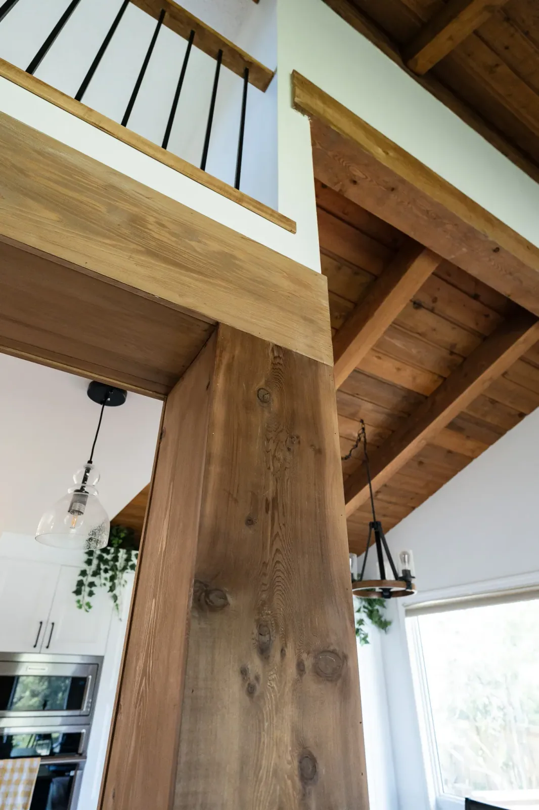 Stained cedar beam and post in a custom home renovation in Calgary 