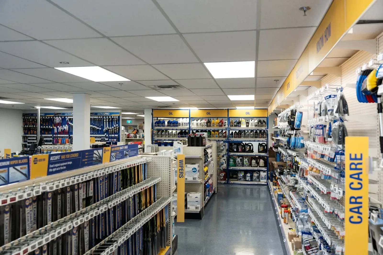 Renovated commercial retail interior with updated shelving, flooring and finishes in Calgary