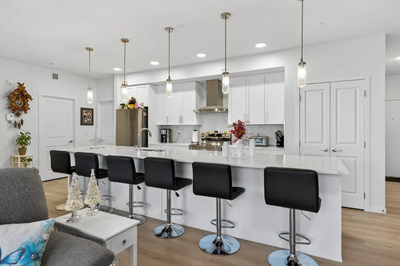 Massive quartz kitchen island in an open-concept complete house renovation in Calgary